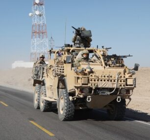 U.S. Marine Corps Maj. Gen. Richard P. Mills, the commander of Regional Command Southwest (RC SW); and Sgt. Maj. Michael Barrett, the sergeant major of RC SW, travel to Maiwand, Afghanistan, Jan. 26, 2011, to receive updates on road construction and security operations. They also traveled to Lashkar Gah in Helmand province to meet with Helmand province Gov. Gulab Mangal and other Afghan leaders in support of the International Security Assistance Force. (U.S. Marine Corps Cpl. Timothy P. Chesnavage/Released)