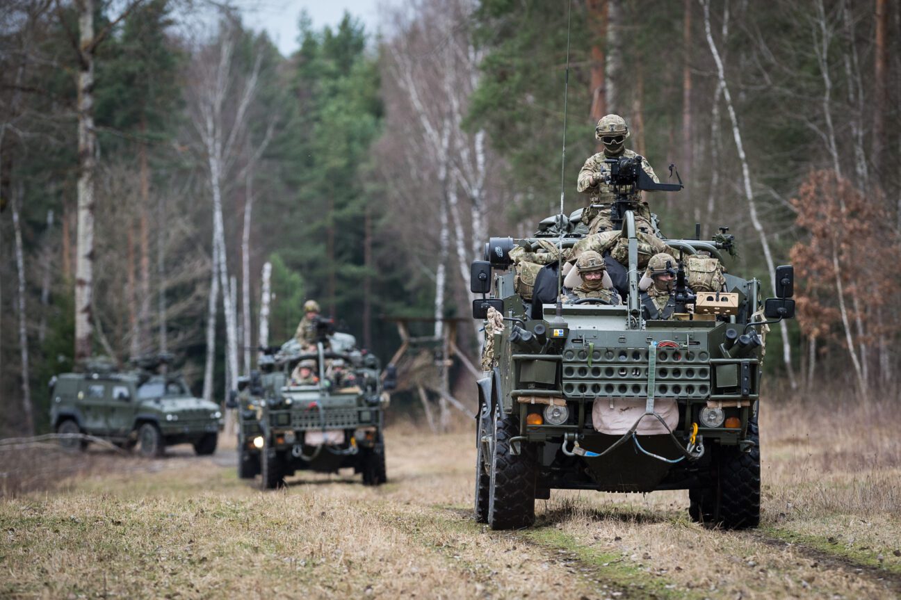 Jackal 2 Armoured Fighting Vehicles and a Panther patrol vehicle drive through wooded area on exercise. Light Dragoons train with US 2nd Cavalry in Germany before eFP deployment to Poland. Soldiers from the Light Dragoons Regiment have been making final preparations with the U.S Army 2nd Cavalry Regiment (2CR) in Germany. The United States is taking the lead role in NATO's enhanced Forward Presence (eFP) deployment to Poland. The UK, who has the lead role in NATO's eFP Estonia is also contributing to eFP Poland, as around 150 troops from the Light Dragoons regiment Based in Catterick, as well as a number of armoured vehicles, will travel with the U.S. 2CR to Orzysz in north east Poland. Photographer - Mr Dominic King - Army Press Office Germany Info; The Light Dragoons are a Light Cavalry Regiment in the Adaptive Force. As the name suggests, Light Dragoons were originally Light Cavalry mounted on fast horses, able to move quickly across the battlefield. Today, mounted on Jackal Fighting Vehicles, the light nature of the Regiment means they are able to deploy anywhere in the world at very short notice. In 2014 the Regiment changed from Formation Reconnaissance, on the Combat Vehicle Reconnaissance (Tracked) family of vehicles, to Light Cavalry on the Jackal and Coyote wheeled platform. This has seen the unit move into a new role, deploying regularly on overseas training missions across North Africa. The Light Dragoons remains an agile reconnaissance asset quickly deployable to any part of the world as one of three Light Cavalry units across 1st (United Kingdom) Division. With a history to match any regiment across the British Army, The Light Dragoons continues to prove itself on active operations around the world as one of the foremost mounted reconnaissance units. Deployment at the forefront of NATO’s Enhanced Forward Presence under the United States’ 2nd Cavalry Regiment marks the next chapter in their illustrious history. NATO enhanced Forward Pr